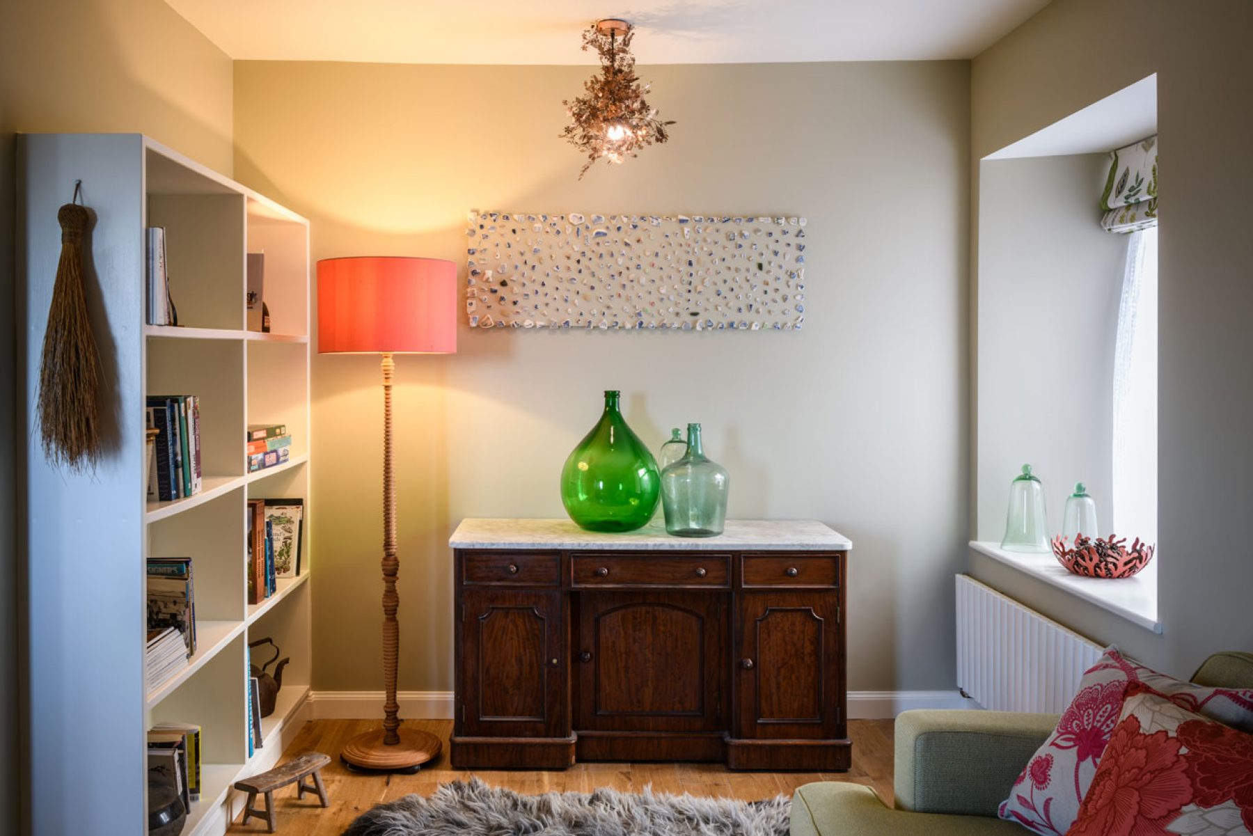 Croft House. The welcoming stone-walled sitting room and library has a toasty wood-burning stove and solid oak floor boards.