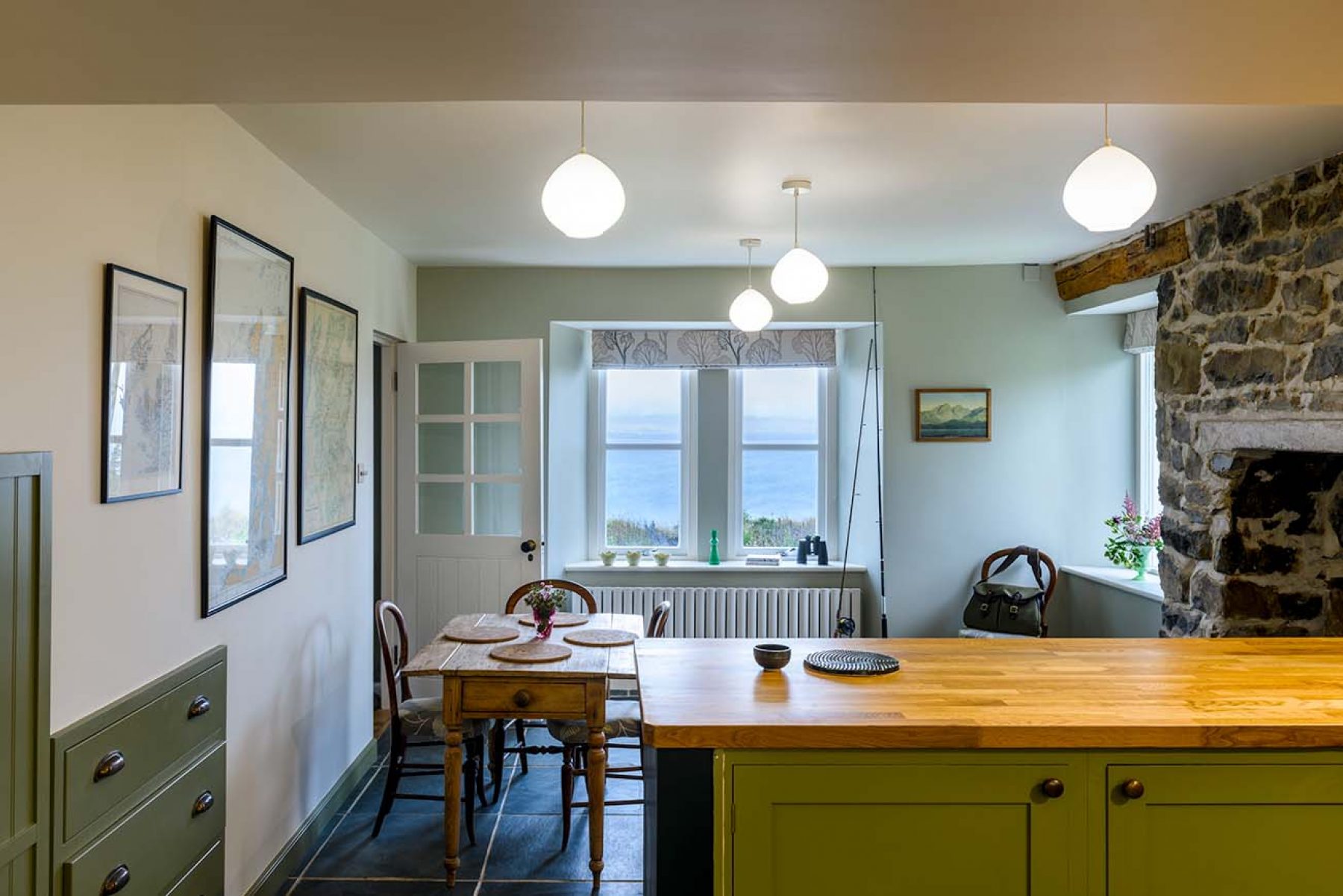 Croft House. A spacious, slate-floored kitchen and dining area feature a fully equipped deVOL hand-crafted Shaker kitchen.